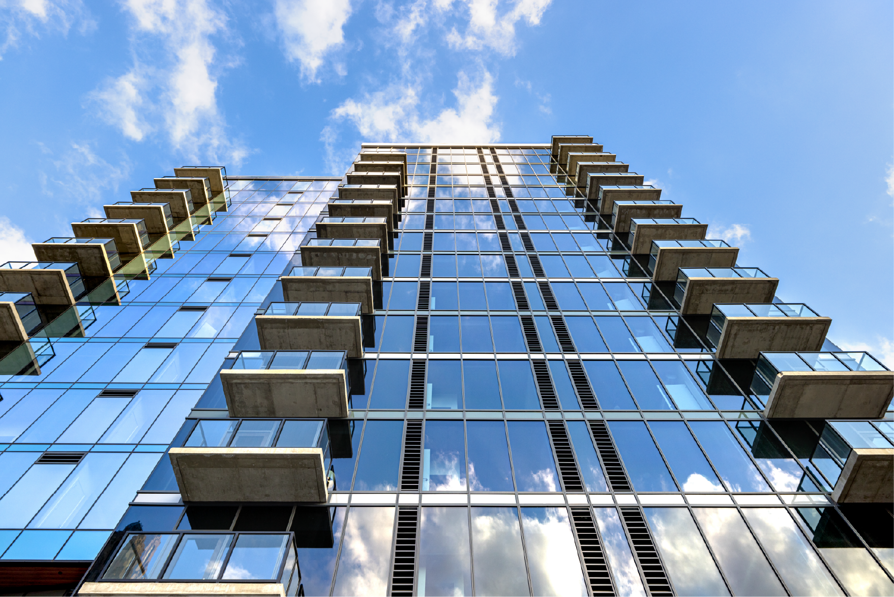The glass facade of Three Light Luxury Apartments in Kansas City, Missouri.
