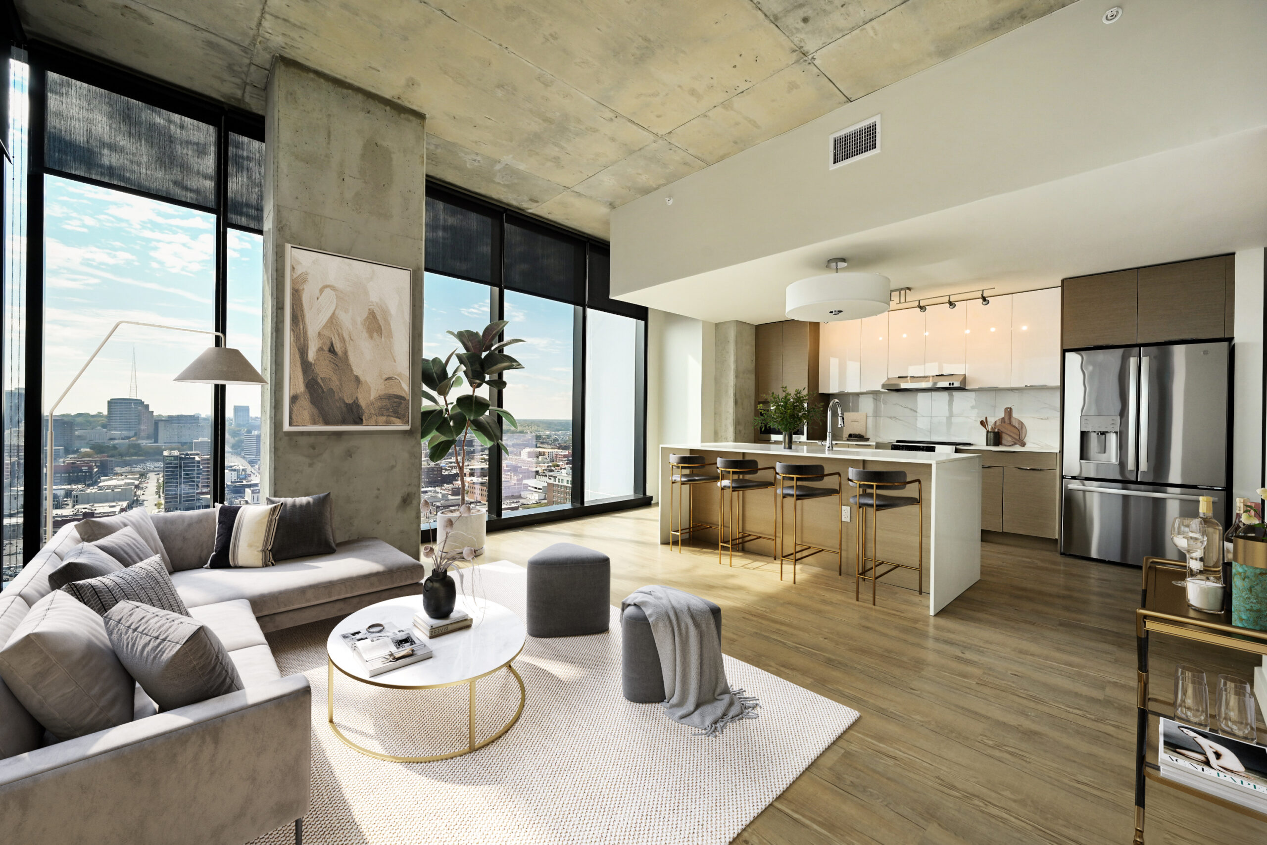 Living room and kitchen at Three Light Luxury Apartments.