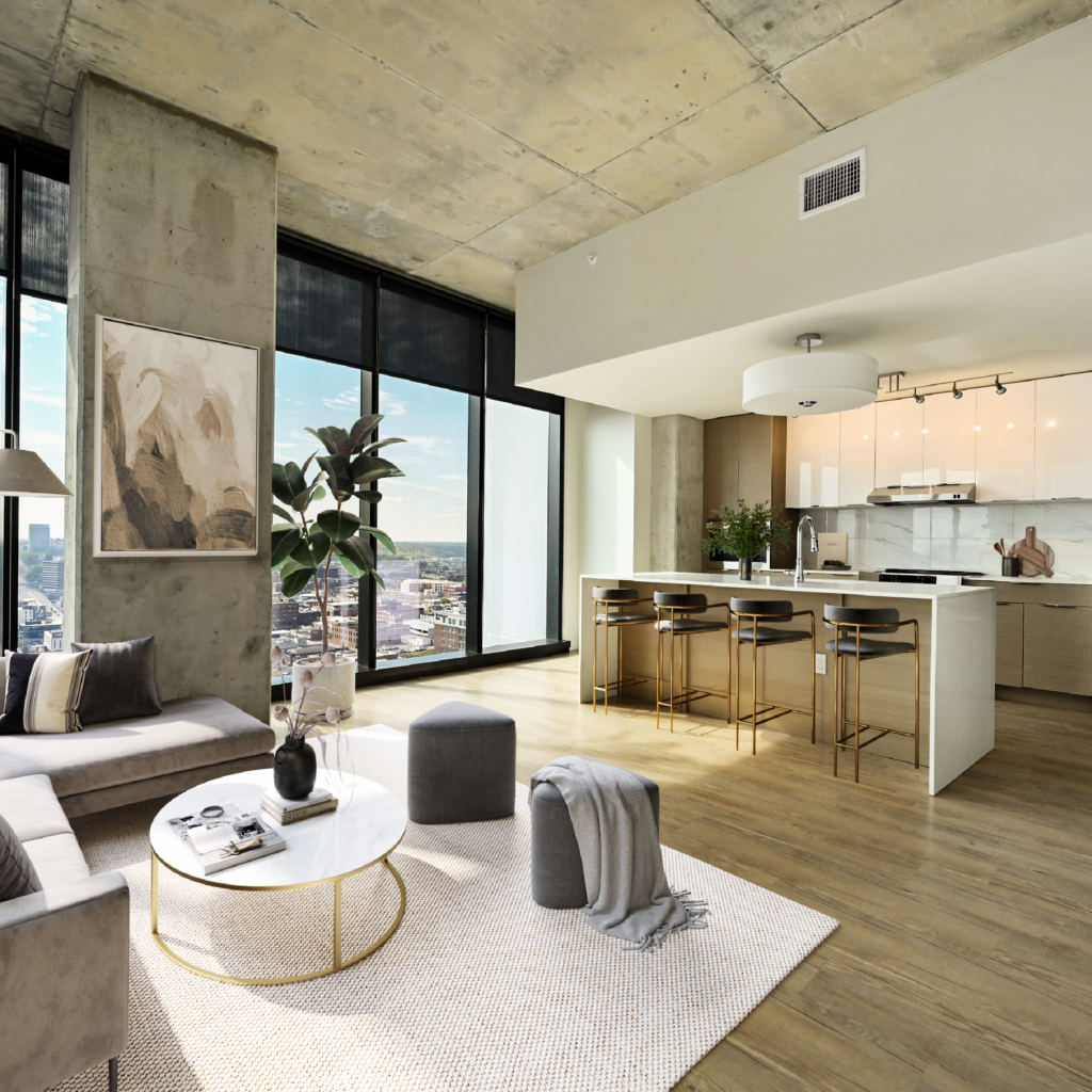 The kitchen and living room of an apartment home at Three Light Luxury Apartments in the Power and Light District in downtown Kansas City, Missouri.
